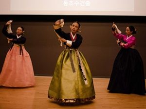 Three women performance a traditional Korean performance