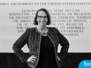Headshot of Tori Smith Ekstrand, background states first amendment