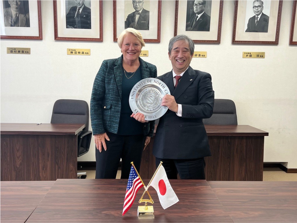 Stephenson and Nagoya University President Naoshi Sugiyama with the UNC seal.