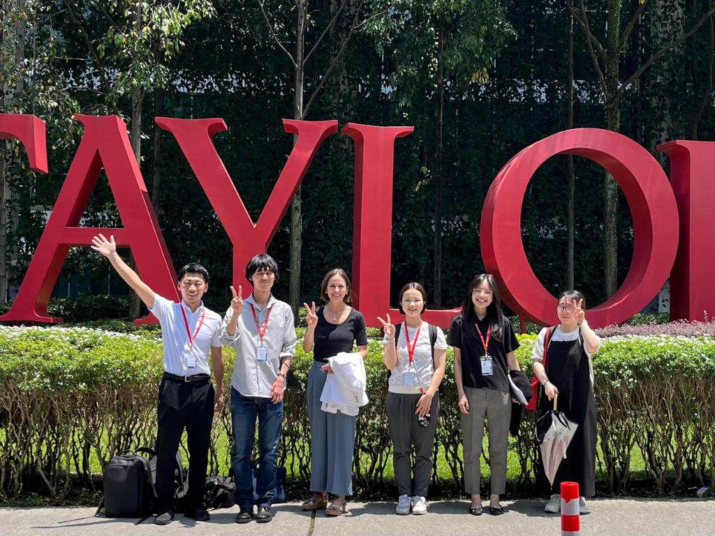 Heather Ward stands in front of Taylor's University in Kuala Lumpur, Malaysia, while participating in a JIGE-sponsored engagement.