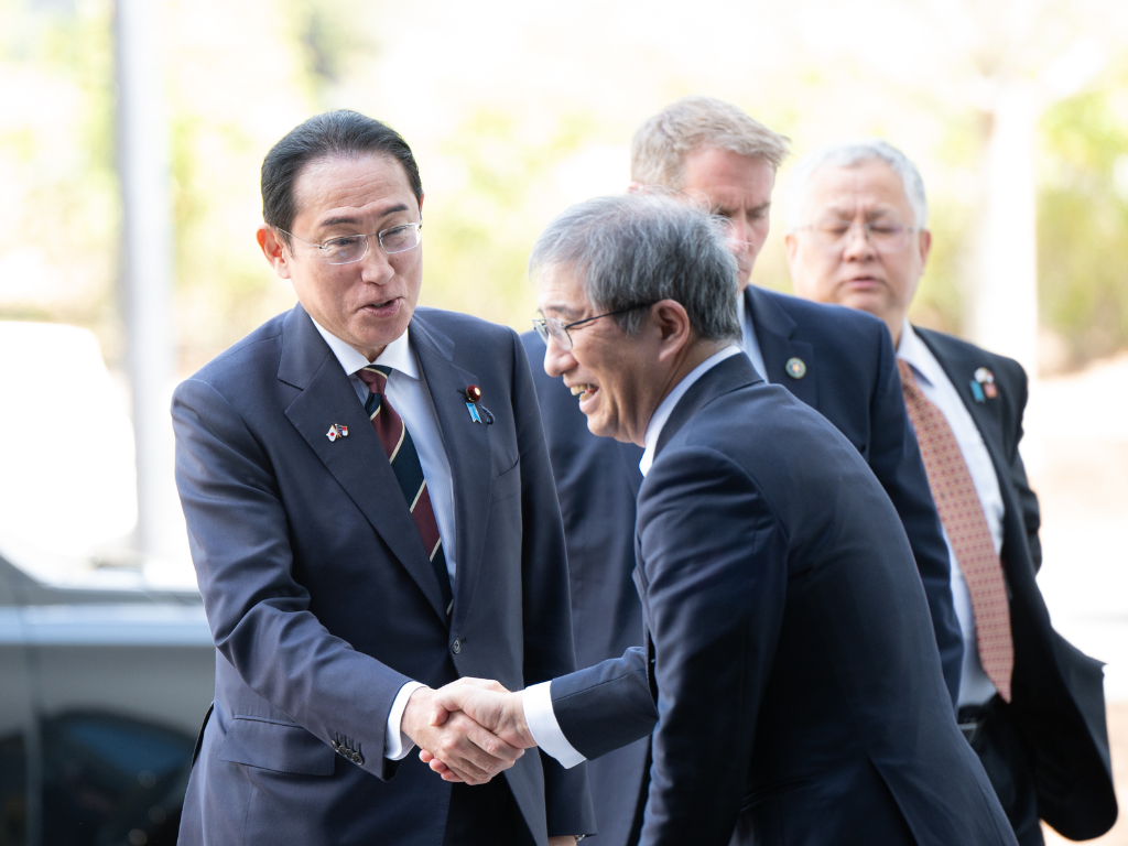 Japanese Prime Minister Fumio Kishida shakes hands with Nagoya University President Naoshi Sugiyama, during his recent visit to North Carolina.
